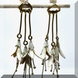 J156. Pair of white enamel gold sterling overlay flower drop earrings . - $36 